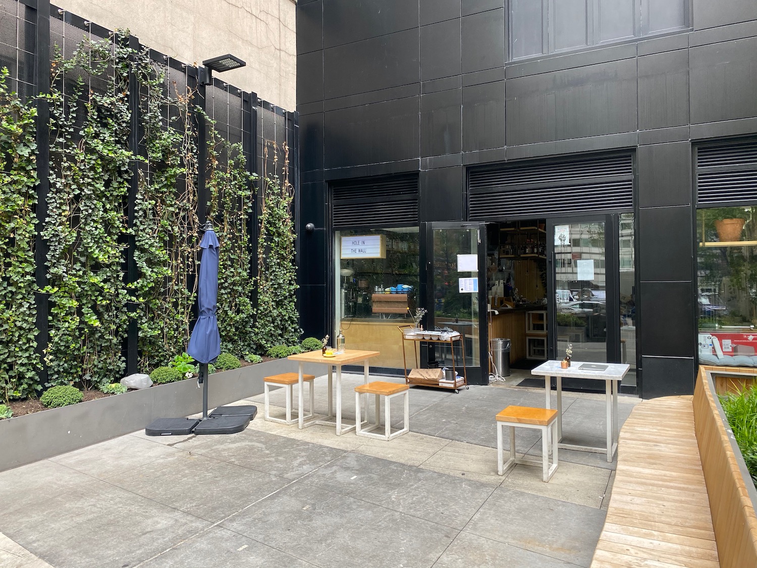 a building with tables and chairs outside