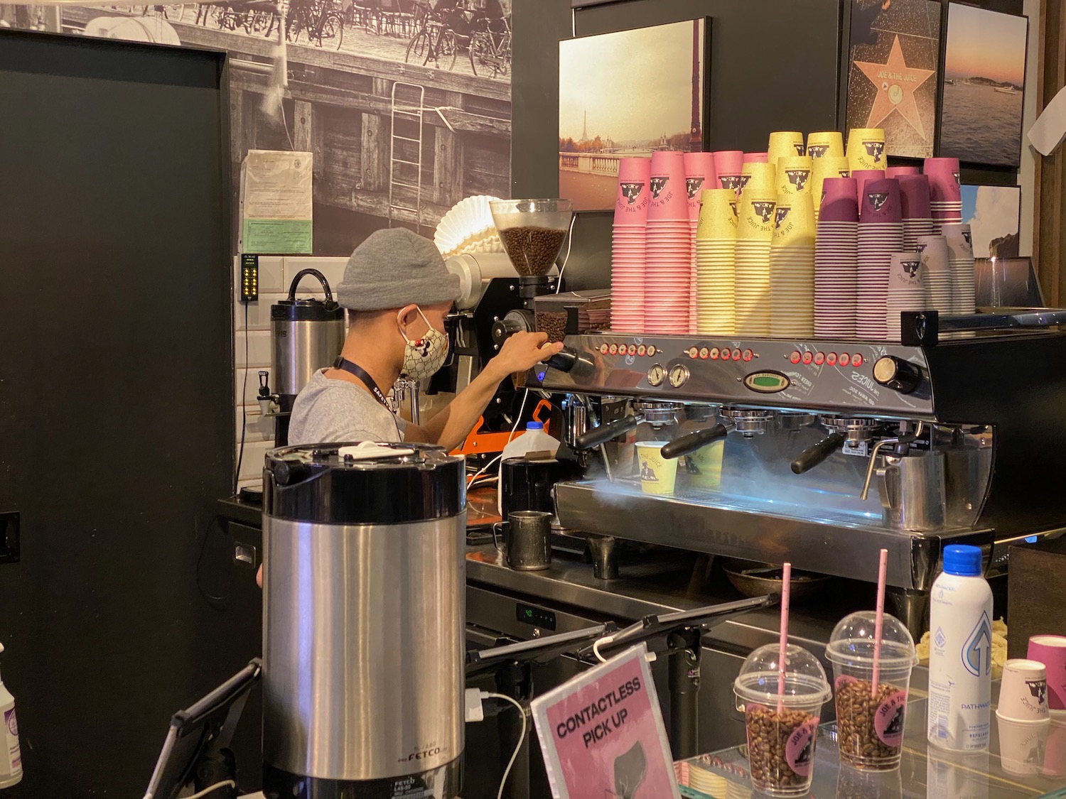 a man making coffee at a coffee machine