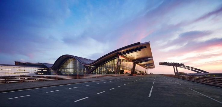 a building with curved roof and a road