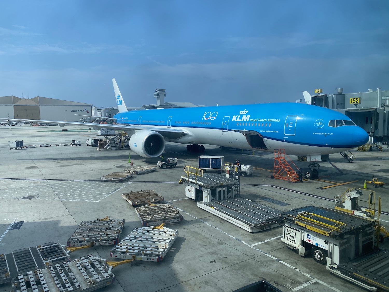 a blue airplane at an airport