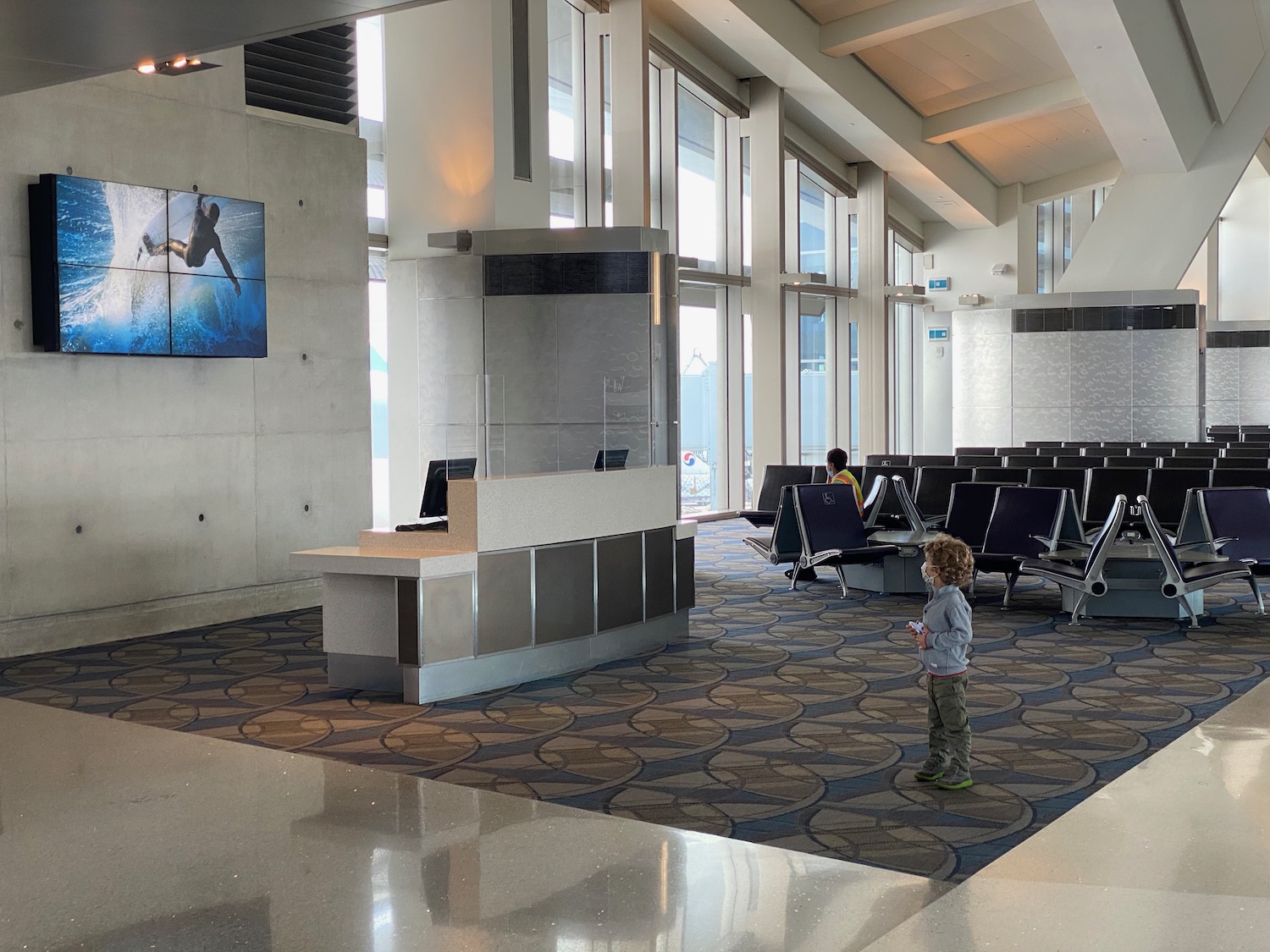 a child standing in a waiting area