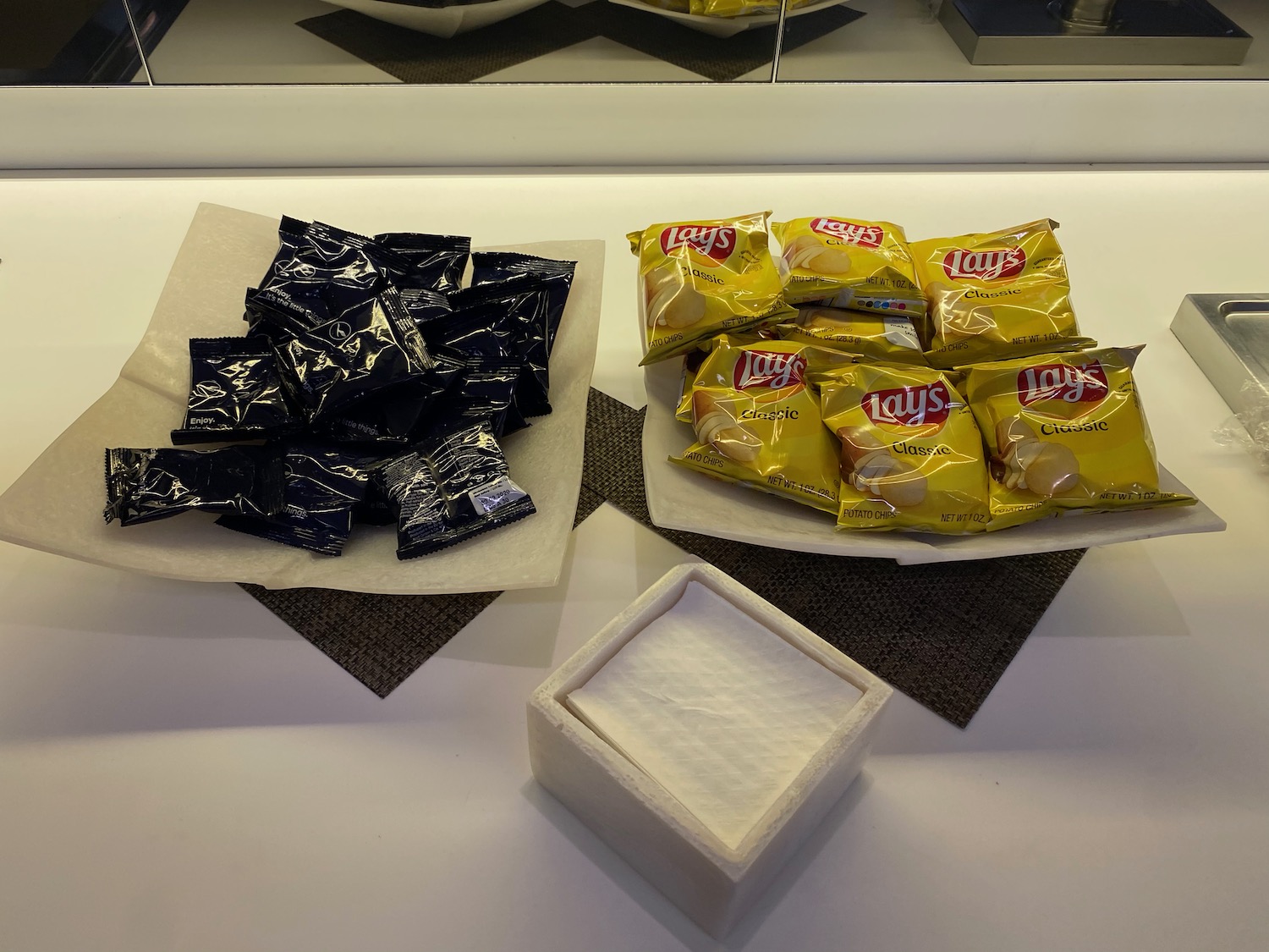 a group of packages of chips on a table