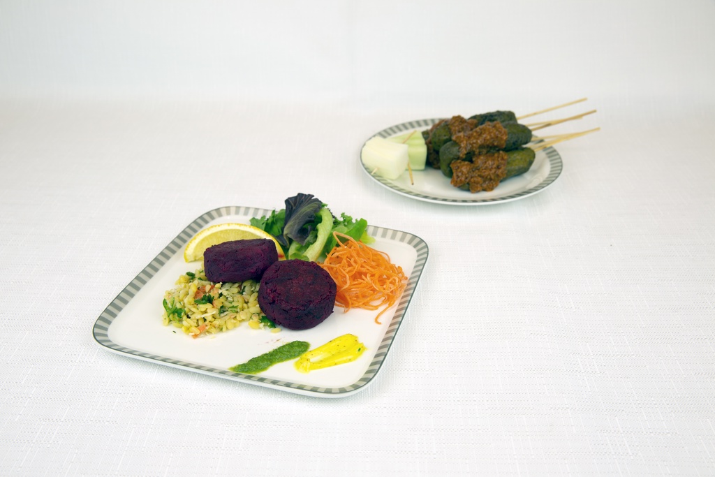 a plate of food on a white surface