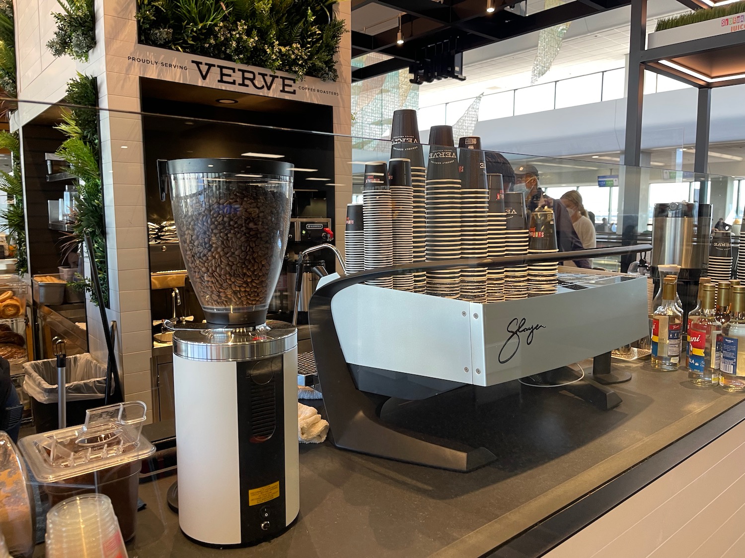 a coffee machine and coffee cups