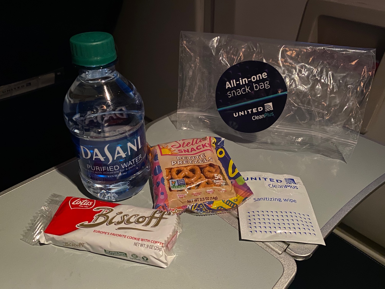 a group of snacks and a bottle of water on a table