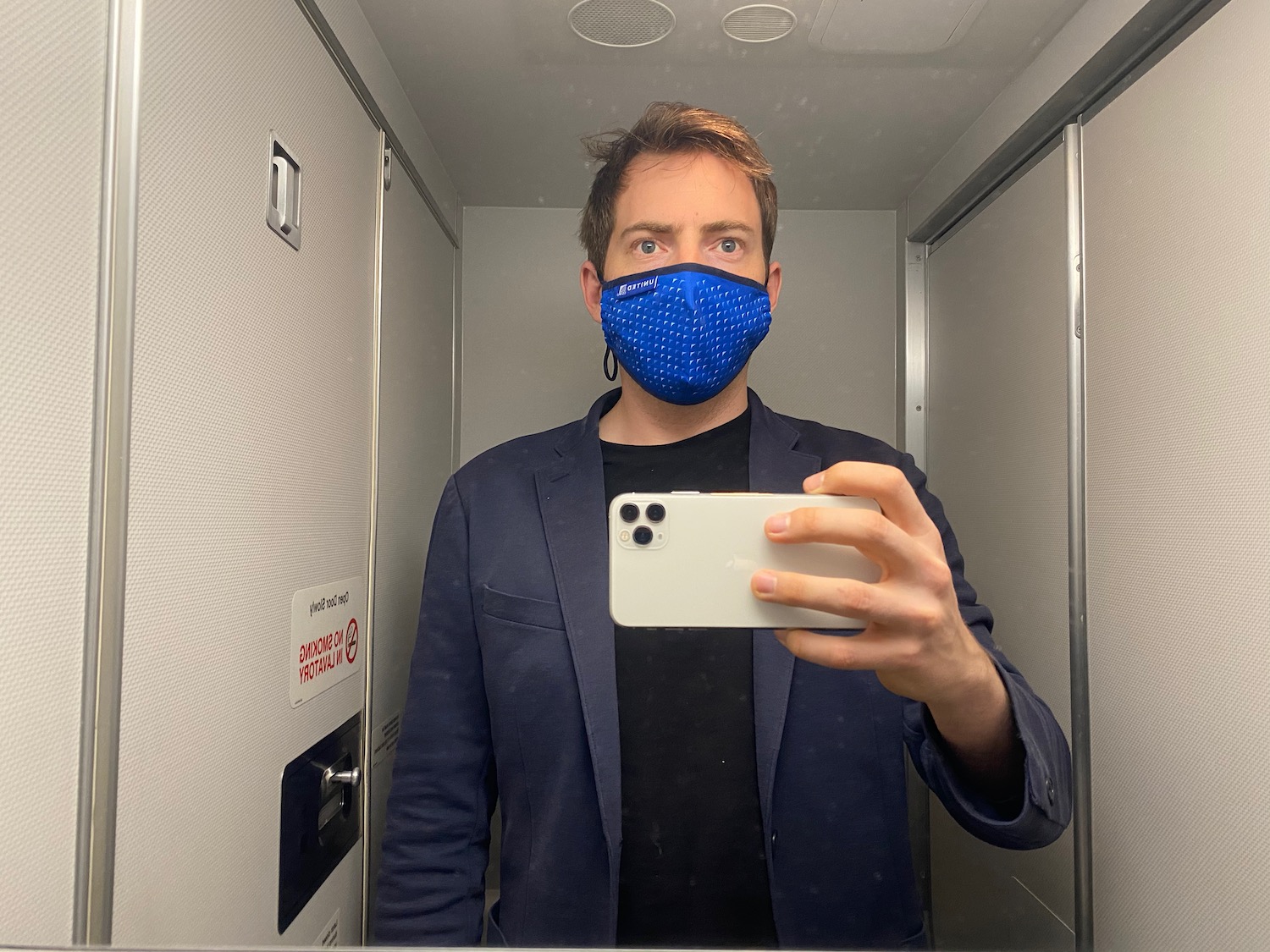 a man taking a selfie in an elevator