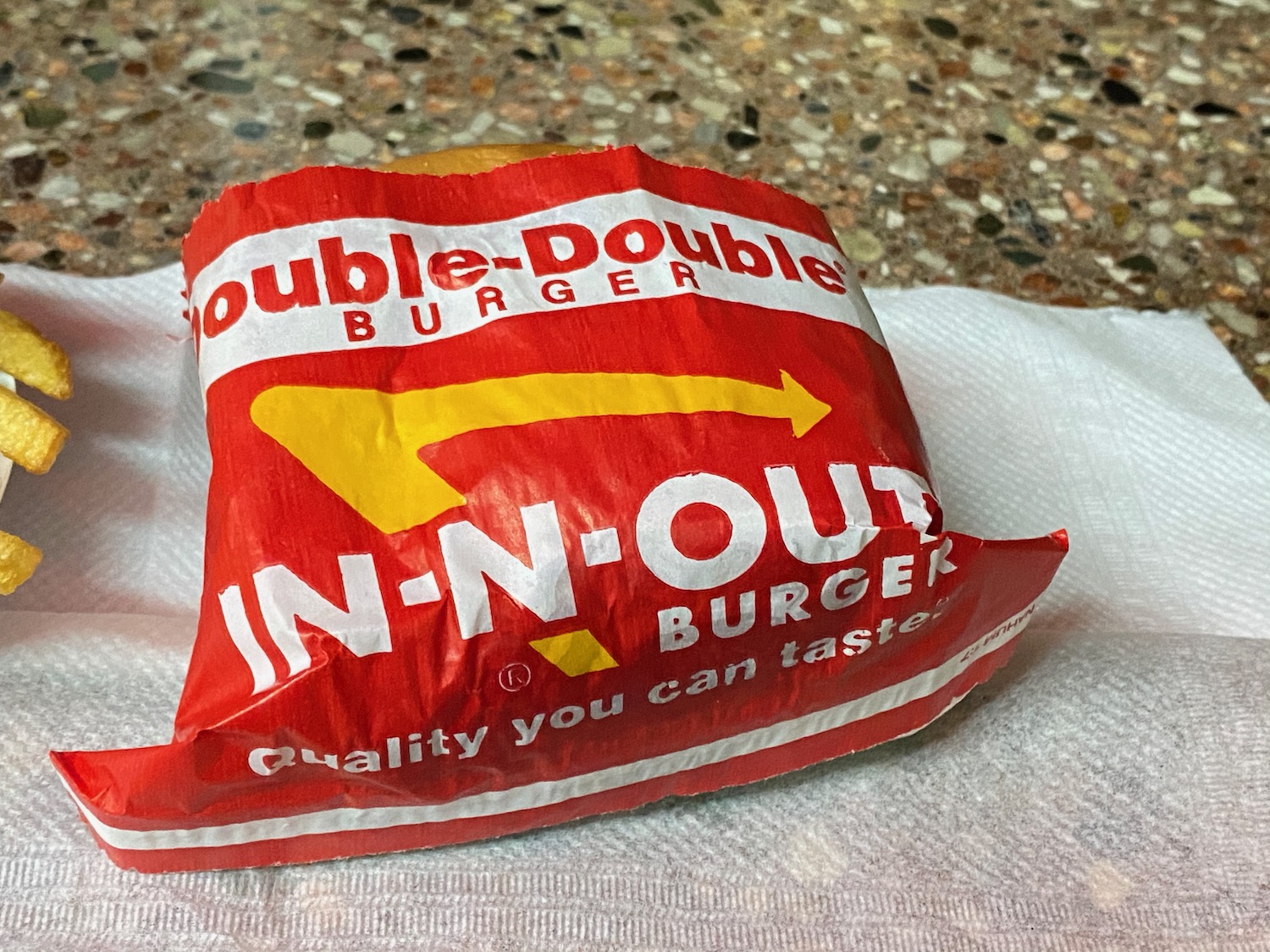 a red and white bag of burger