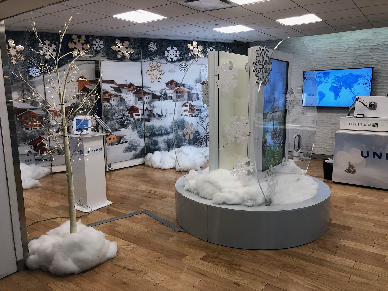 a display of snowflakes and trees in a room
