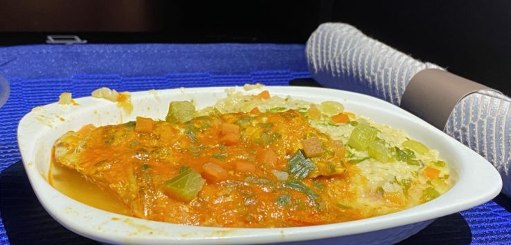 a bowl of food on a blue cloth