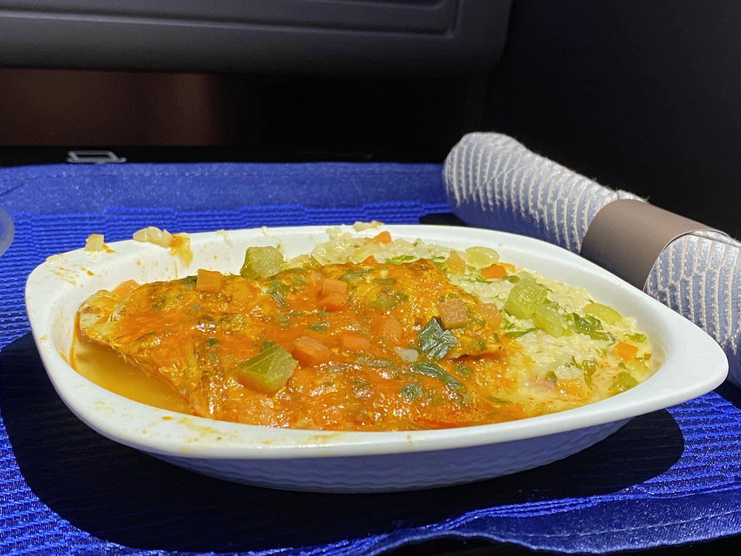 a bowl of food on a blue cloth