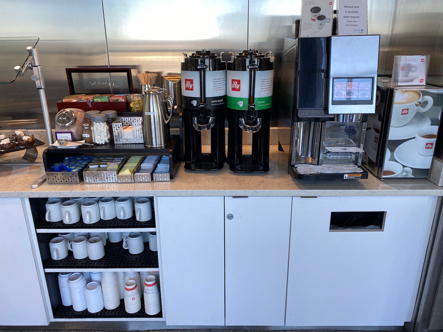 a coffee machine and coffee maker on a counter