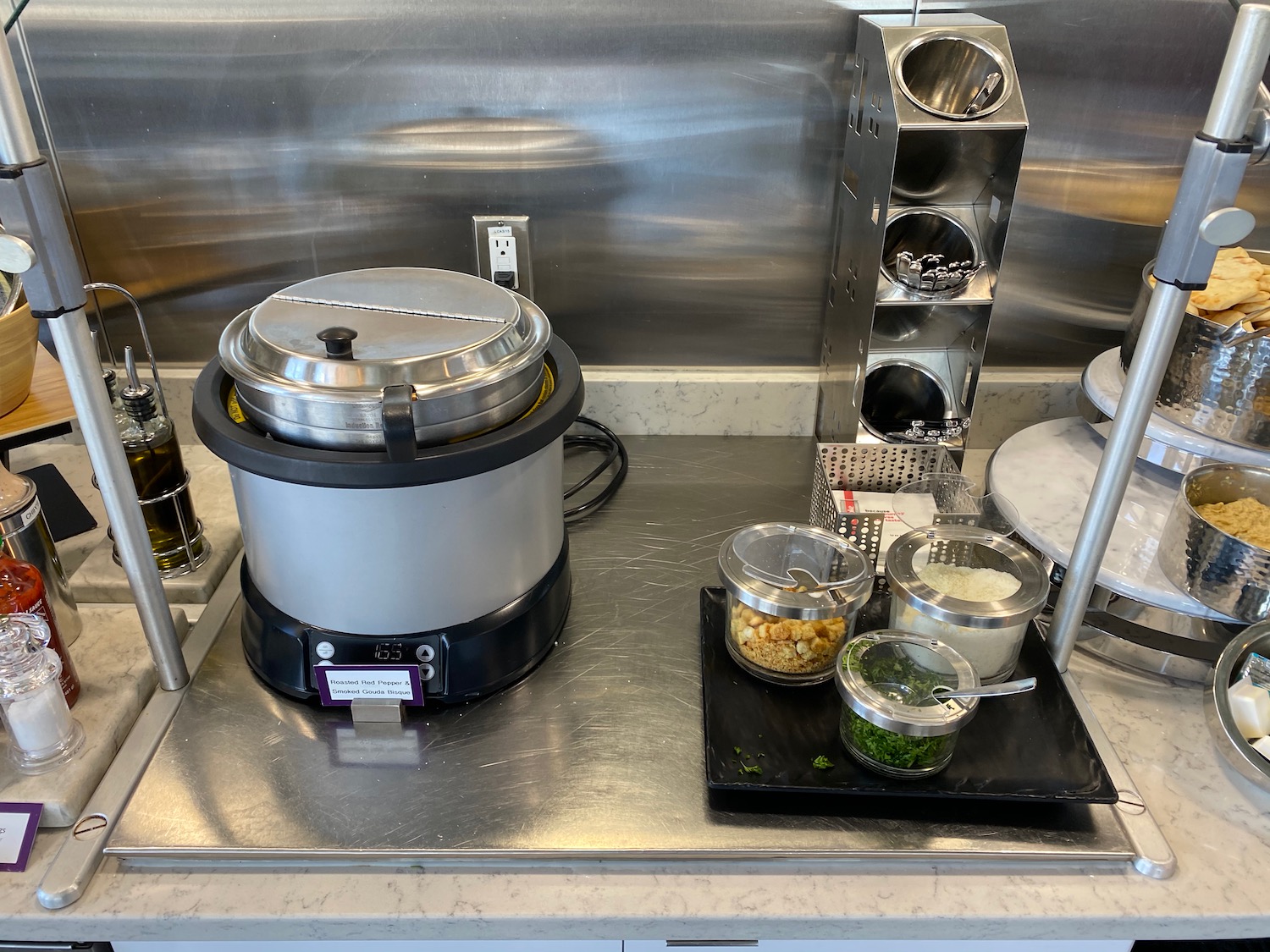 a kitchen counter with food containers and a pot on it