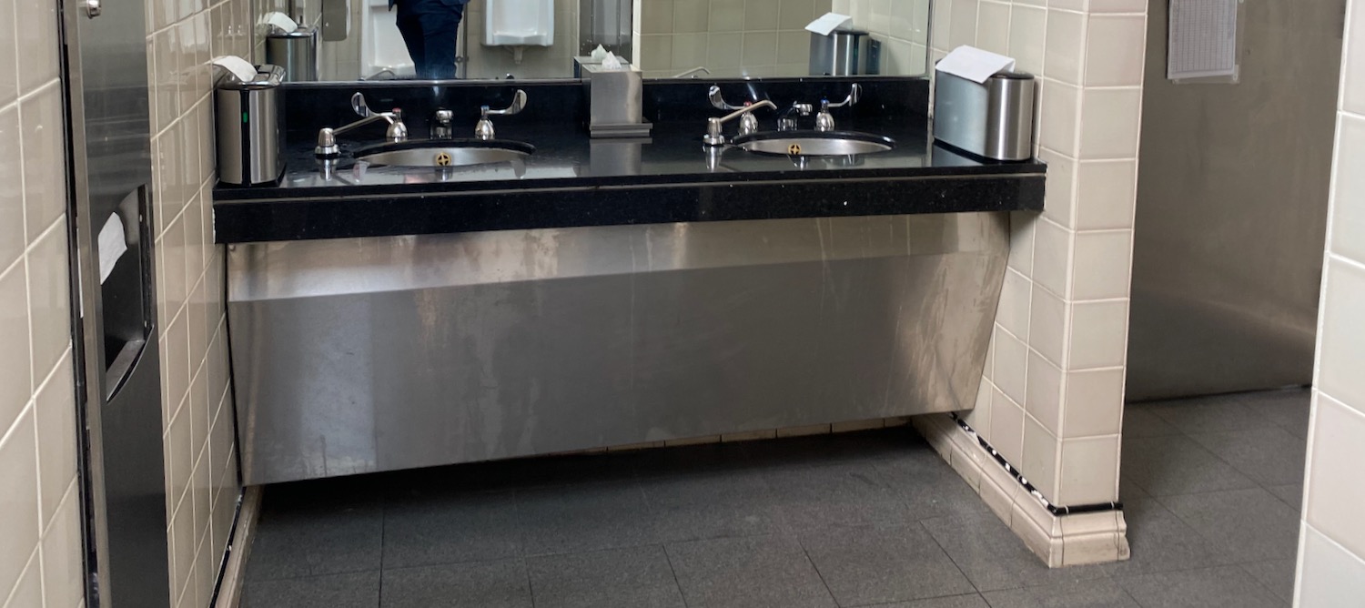 a bathroom sink with a mirror