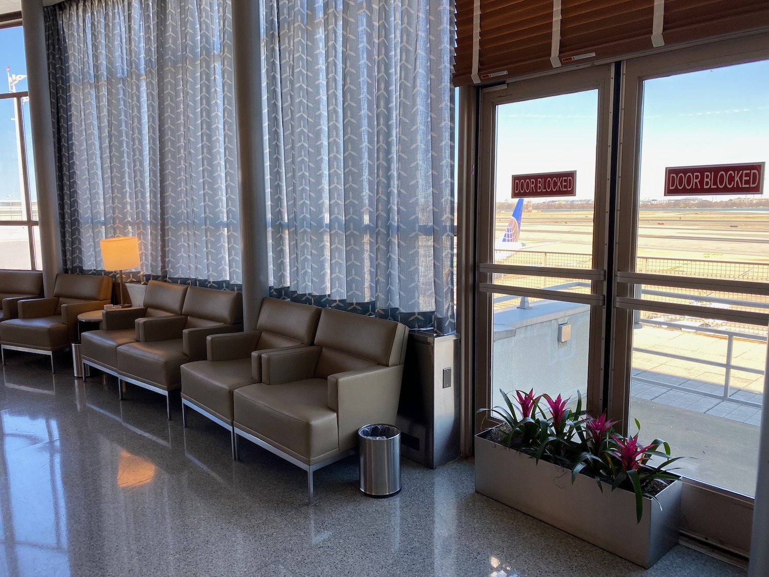 chairs in a room with a window and chairs