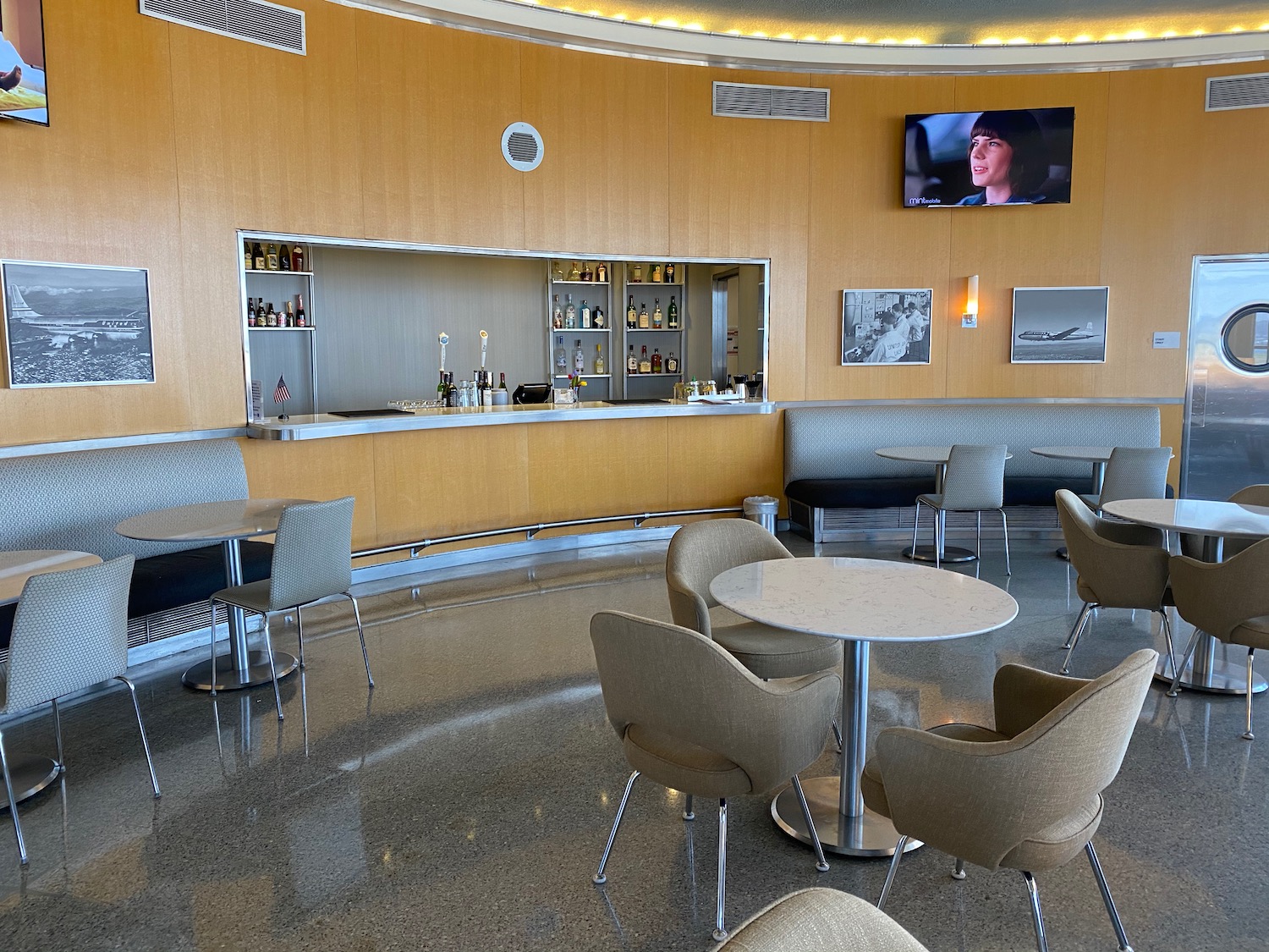 a room with a bar and a table and chairs