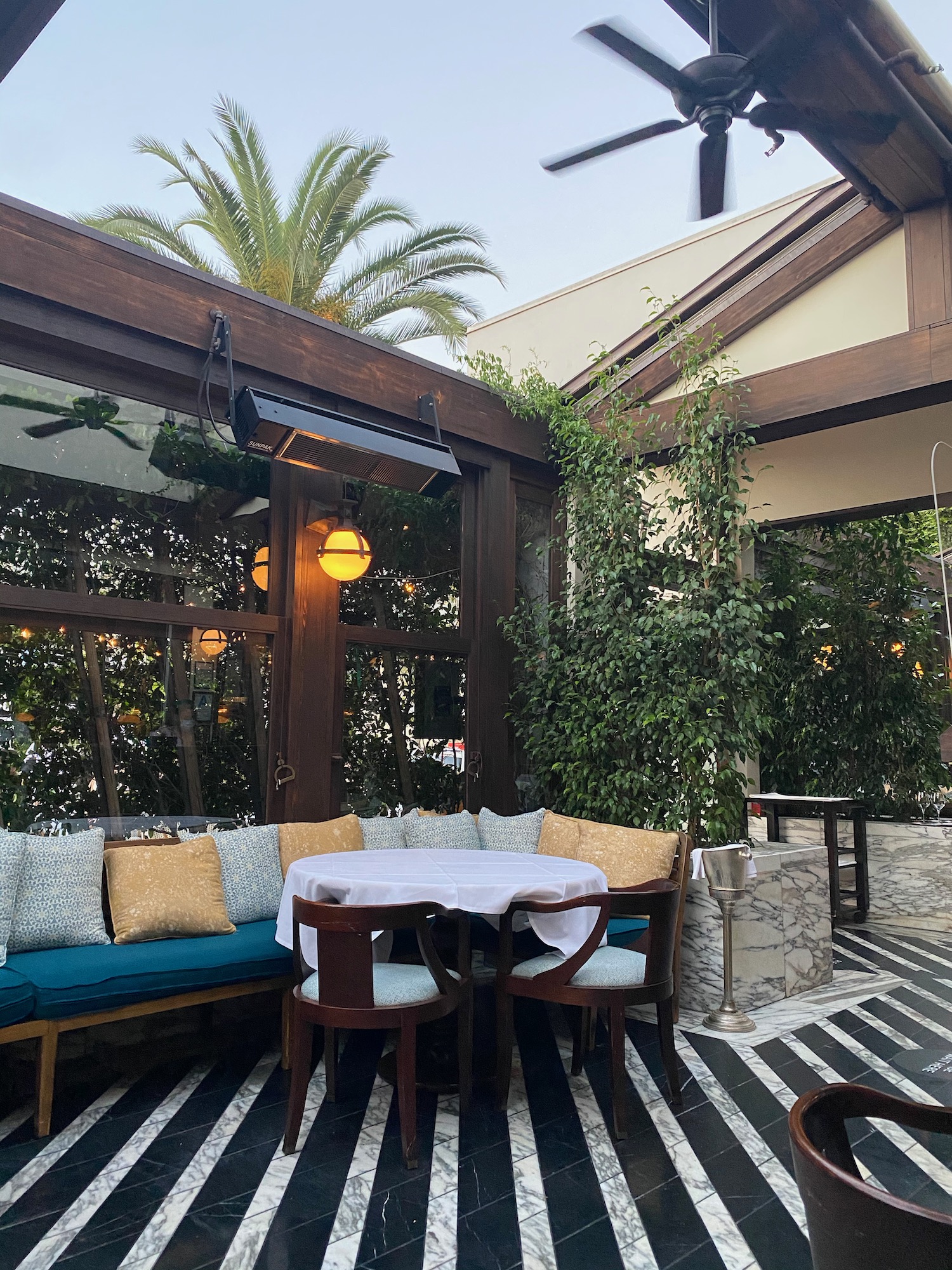 a patio with a table and chairs