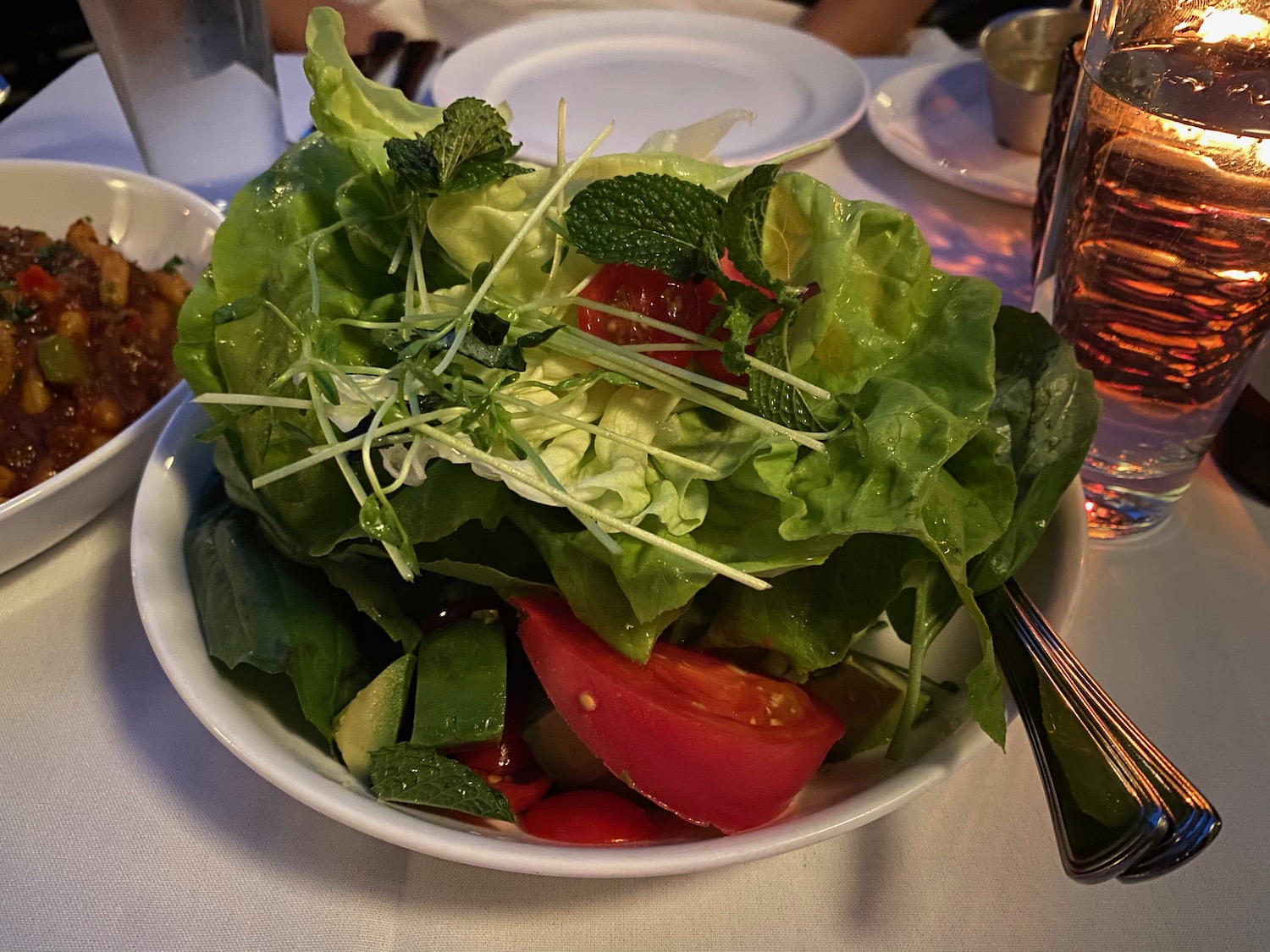 a bowl of salad on a table