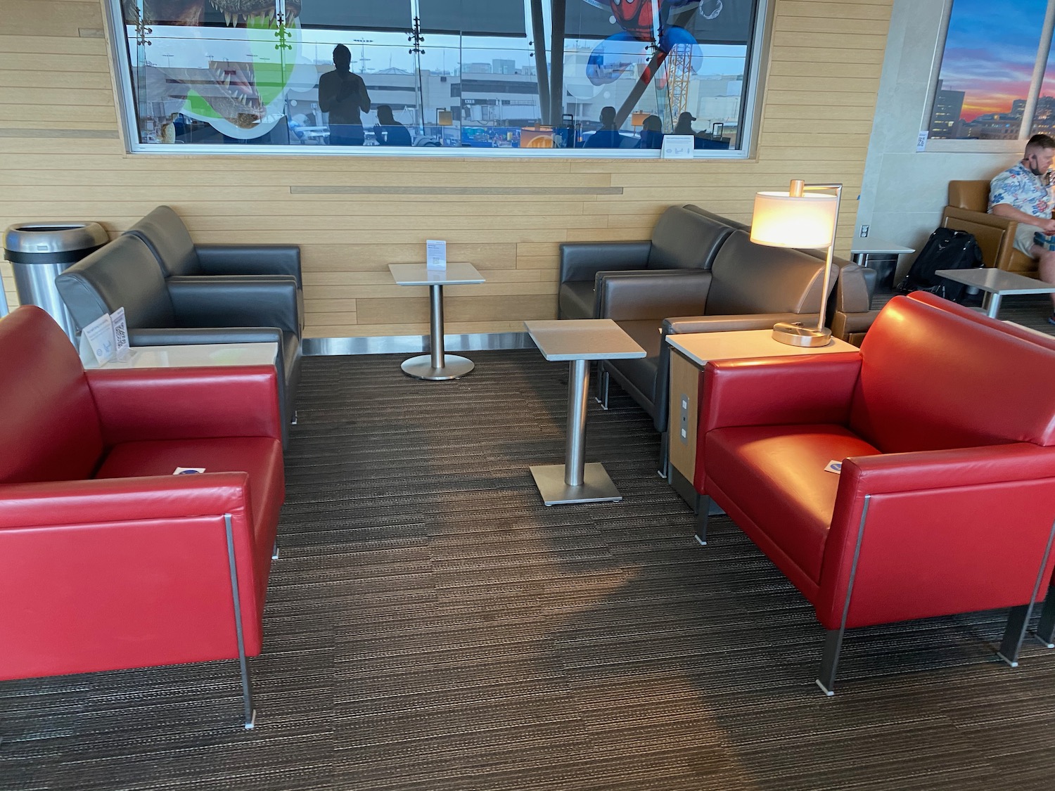 a room with red and black chairs and a table