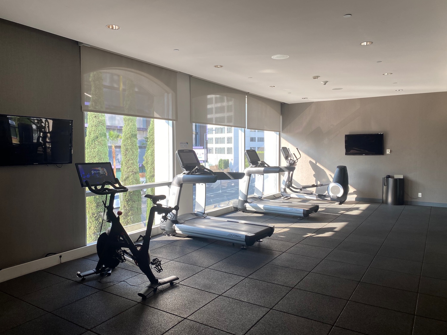 a room with exercise bikes and treadmills