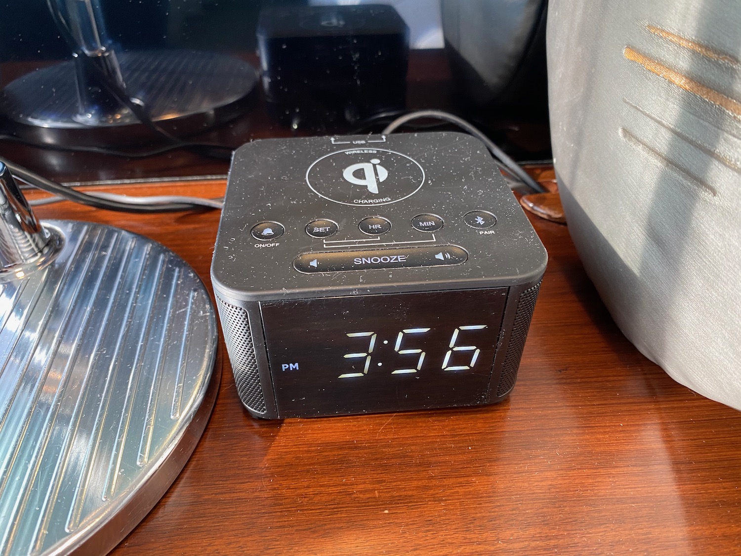 a black alarm clock on a table