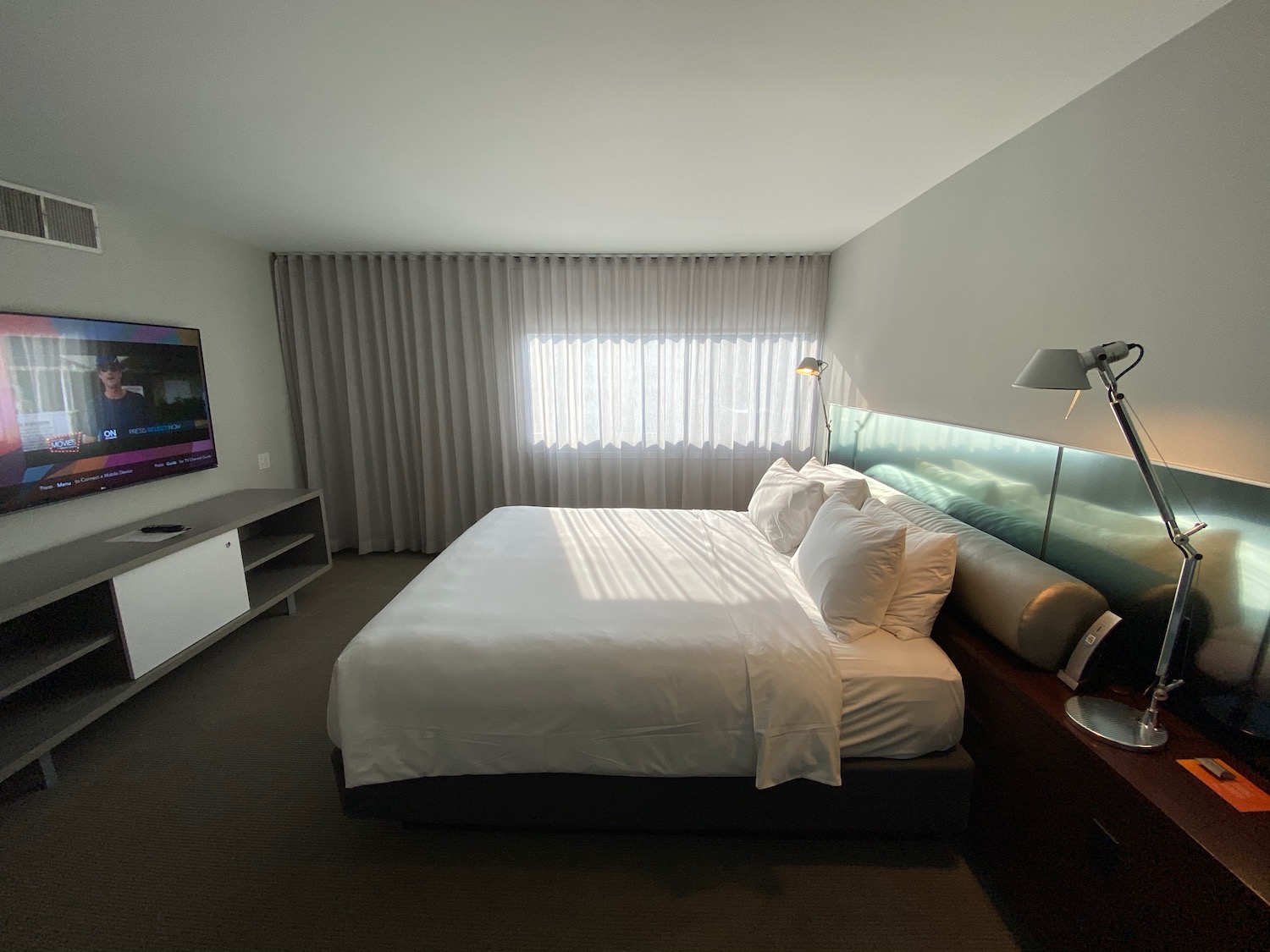 a bed with a tv in a room