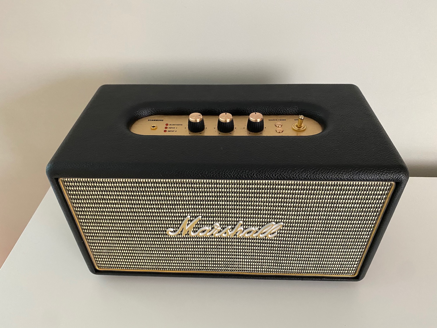 a black and gold speaker