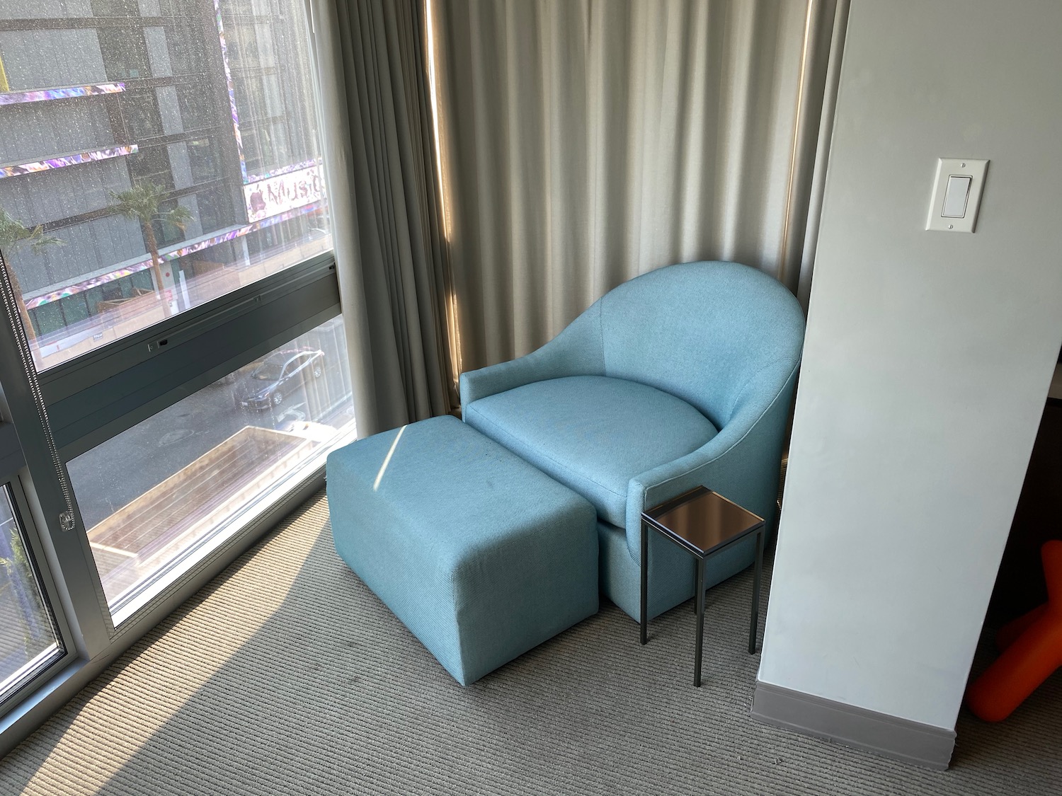 a chair and ottoman in a room