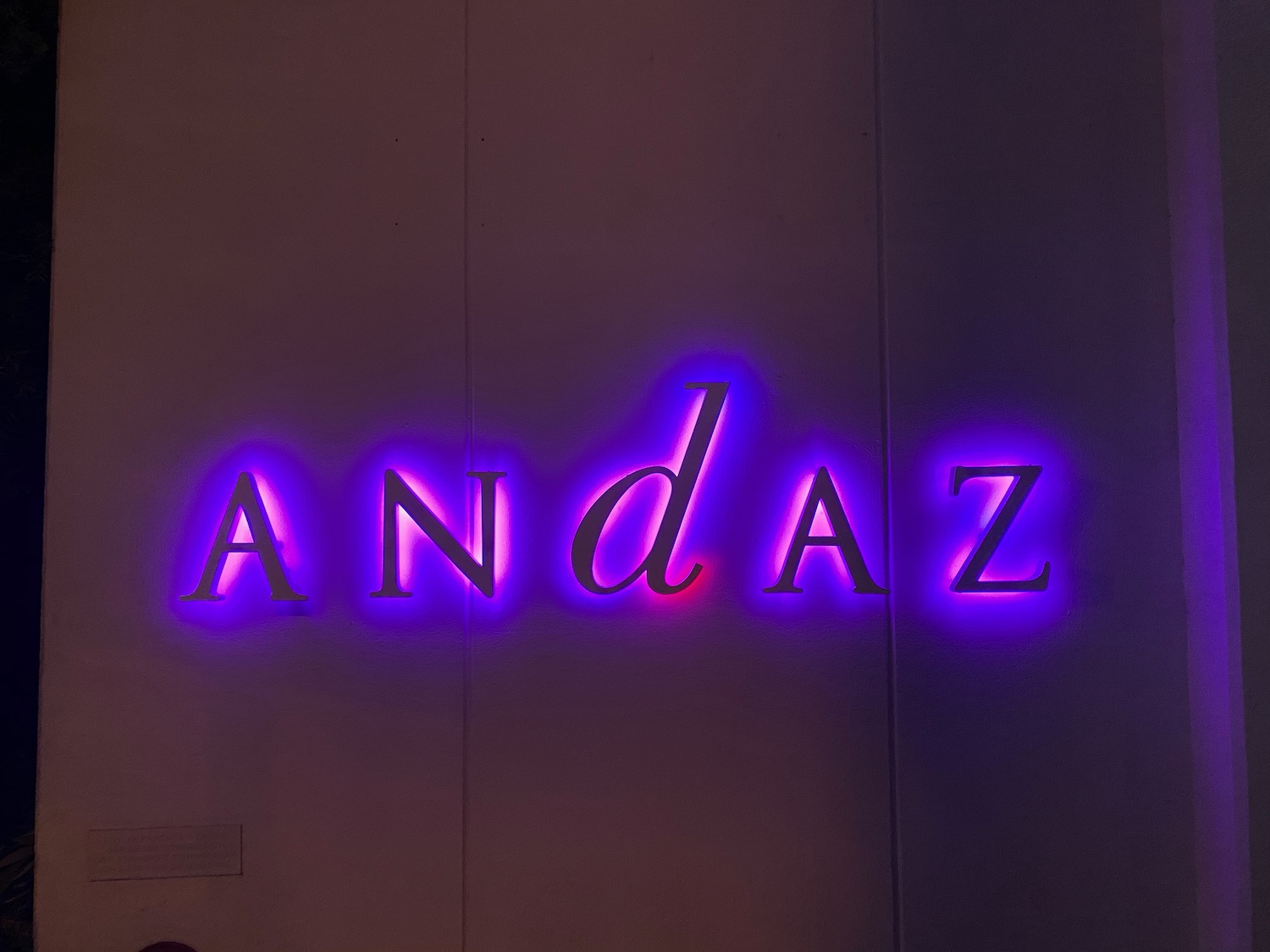 a purple and black lit up sign