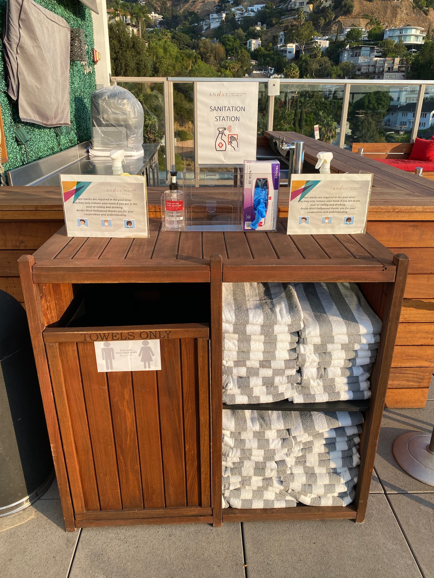 a wooden bin with towels on it