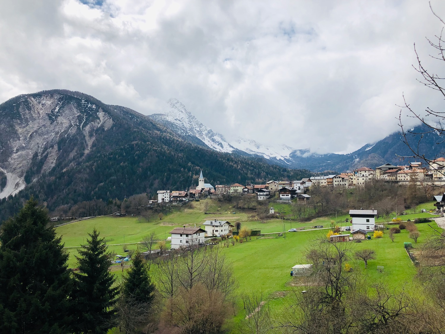 a town on a green hill