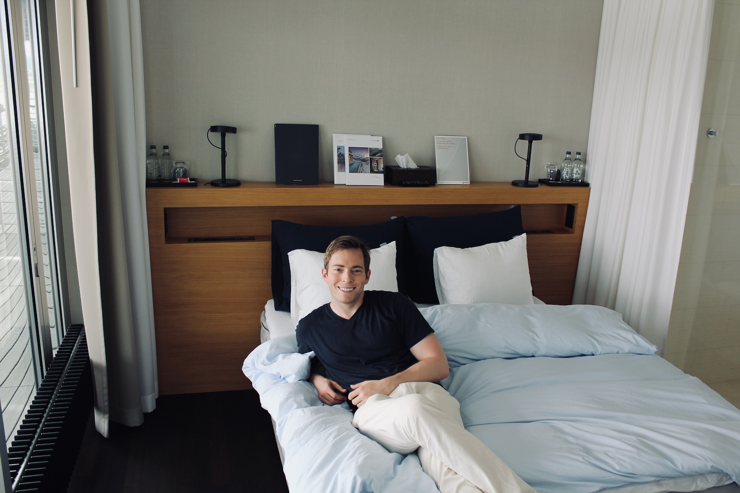 a man sitting on a bed