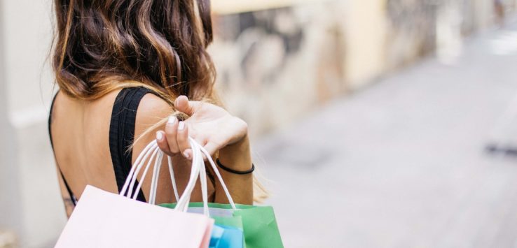 a woman holding shopping bags