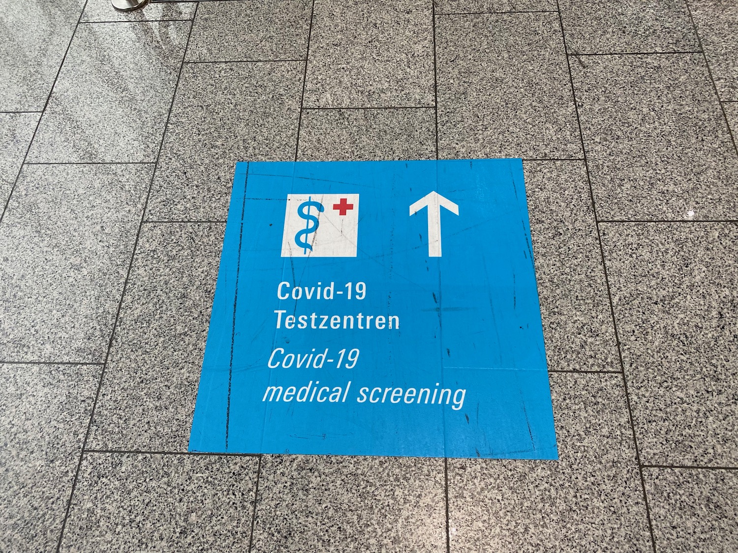 a blue sign on the ground