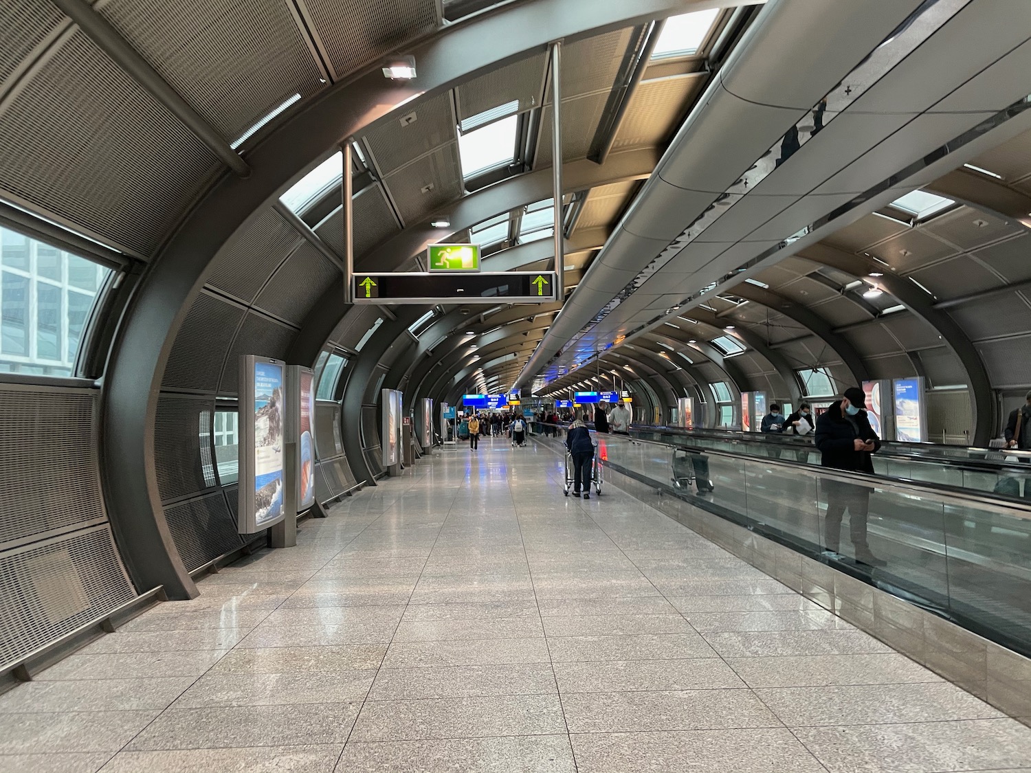 a walkway with people walking on it