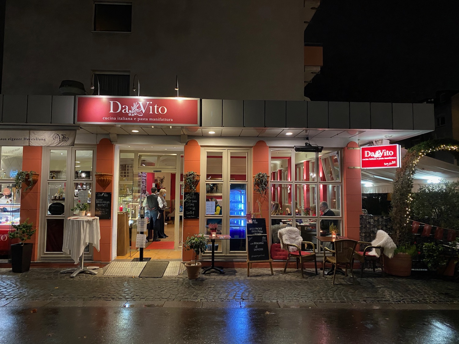 a restaurant with tables and chairs outside