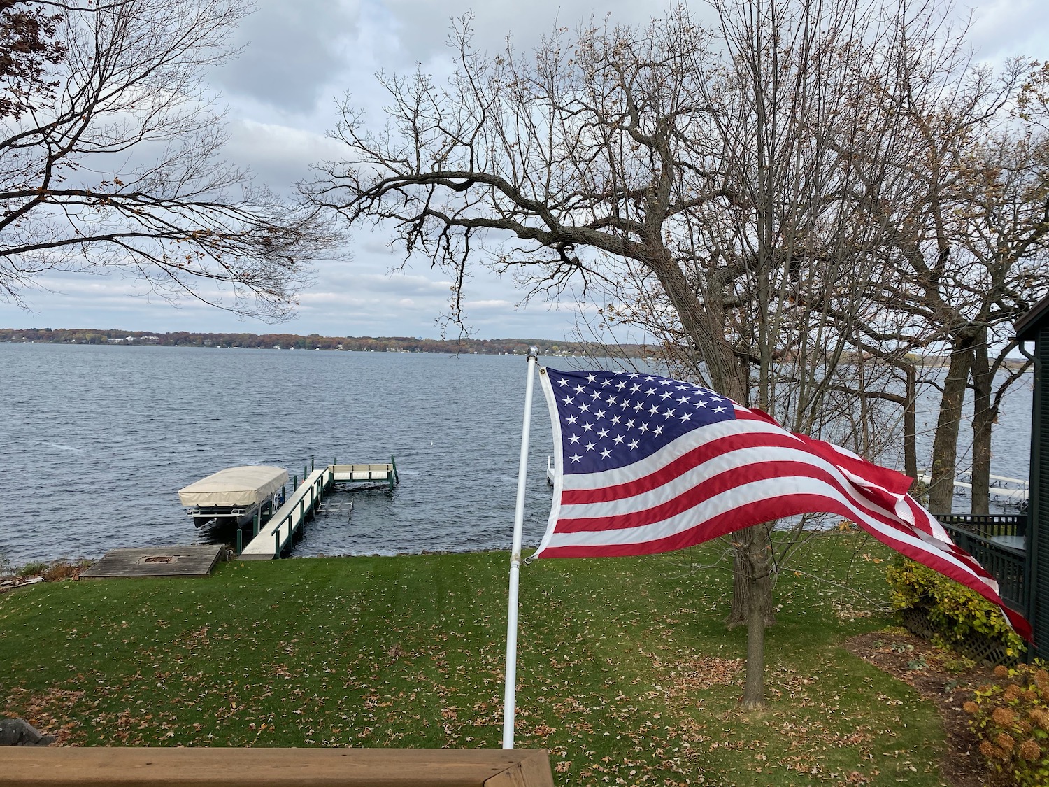 a flag flying over a lake