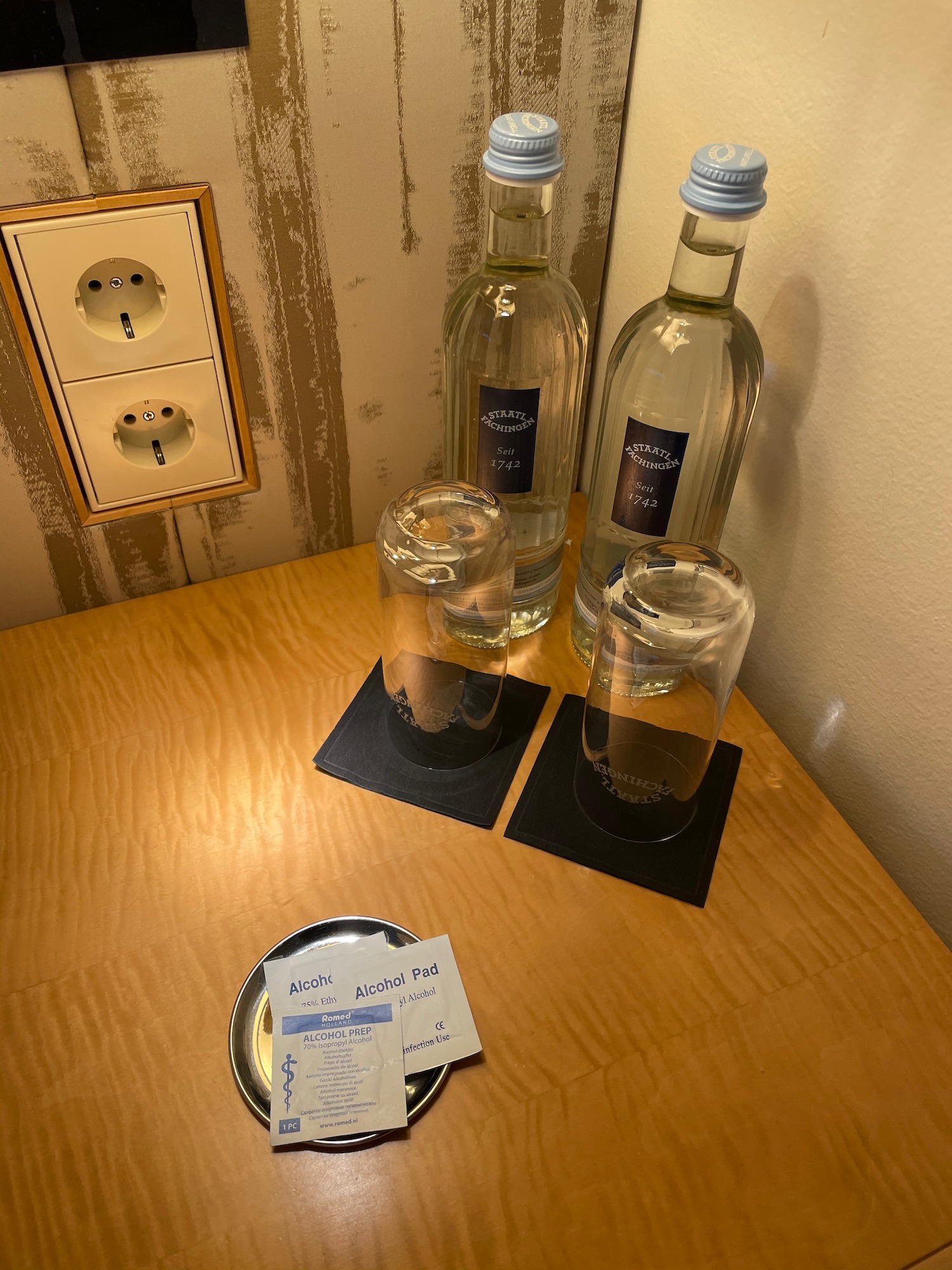 a group of bottles and glasses on a table