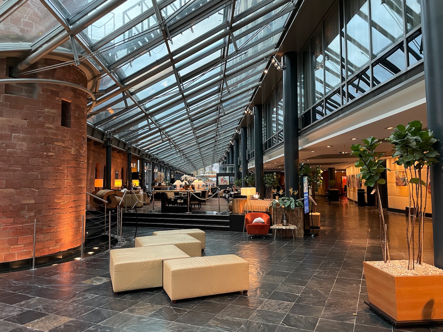 a large room with glass walls and a large ceiling