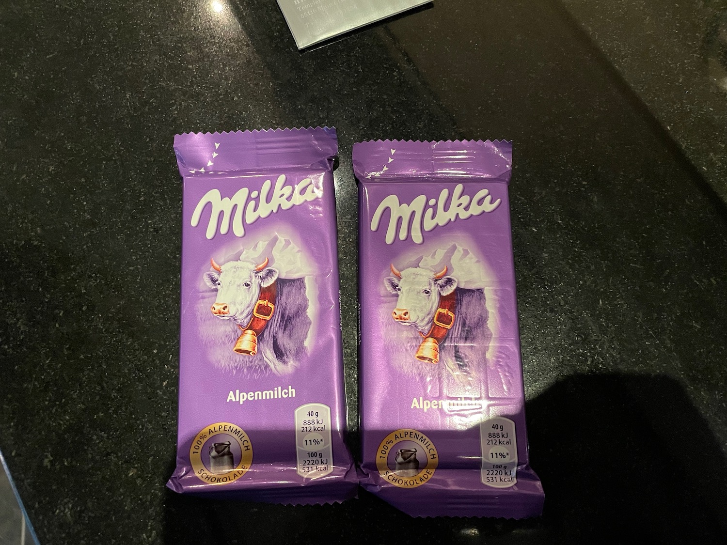 two packages of milka chocolate