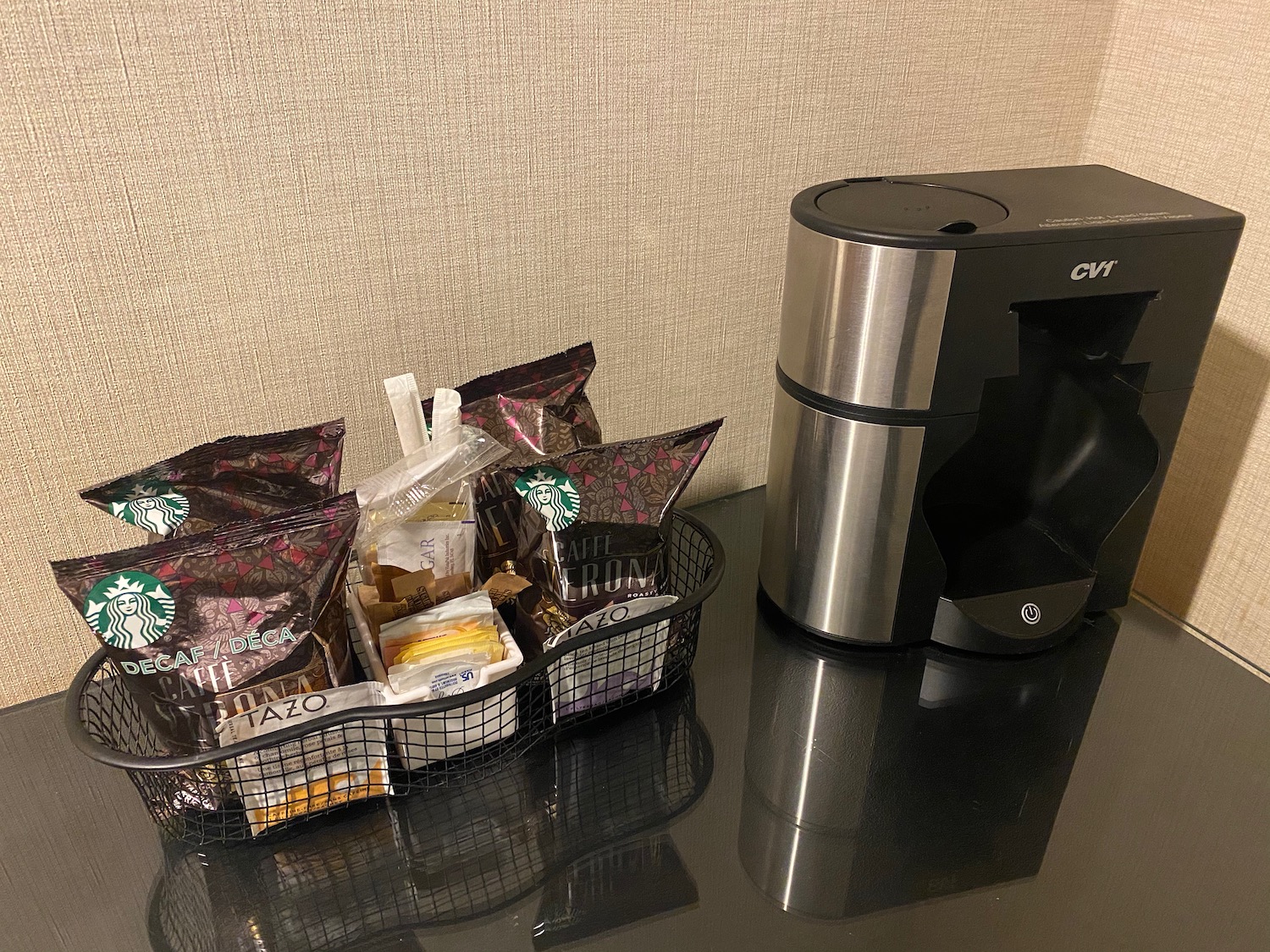 a coffee maker and a basket of food
