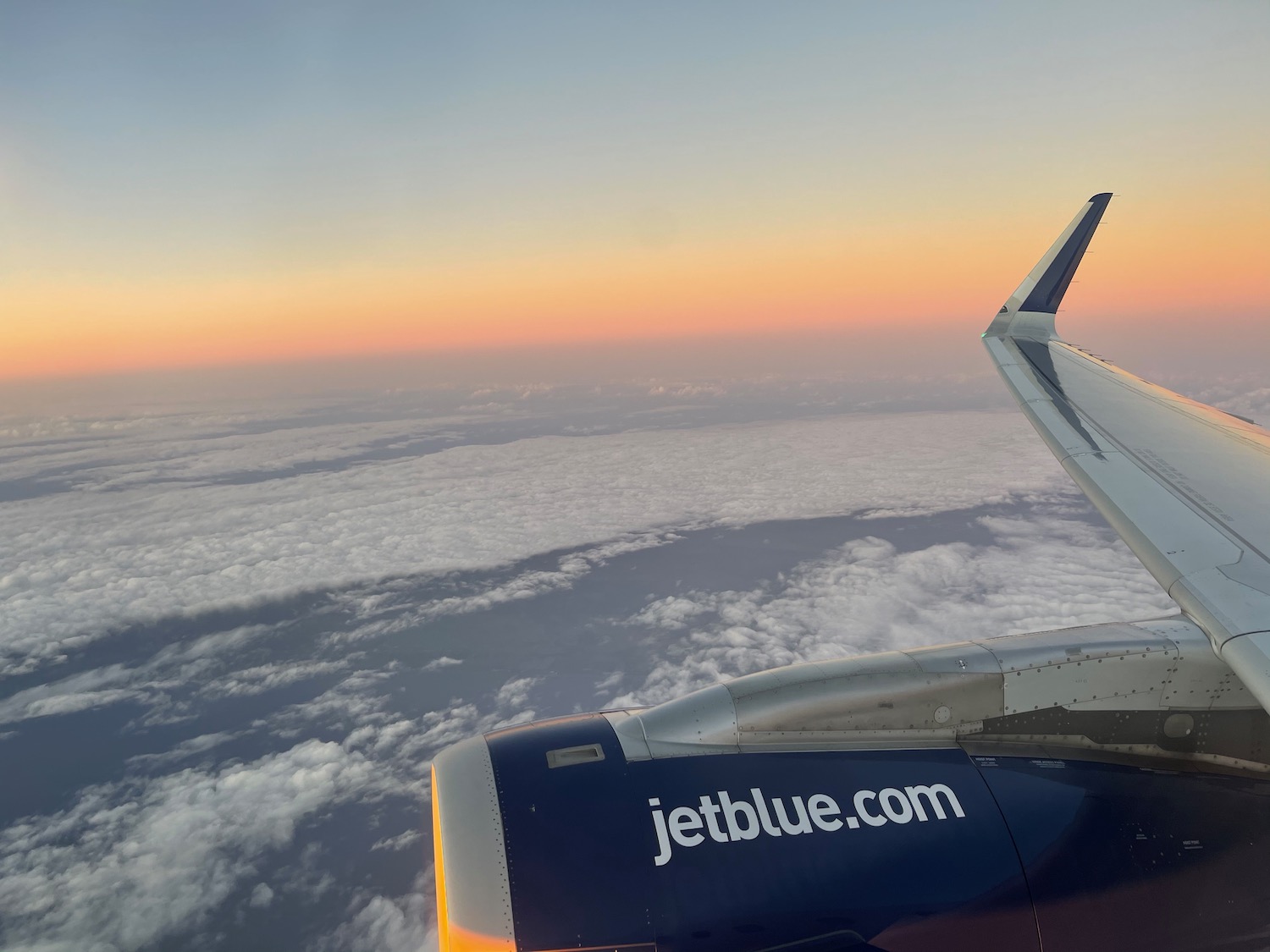 an airplane wing and the sky