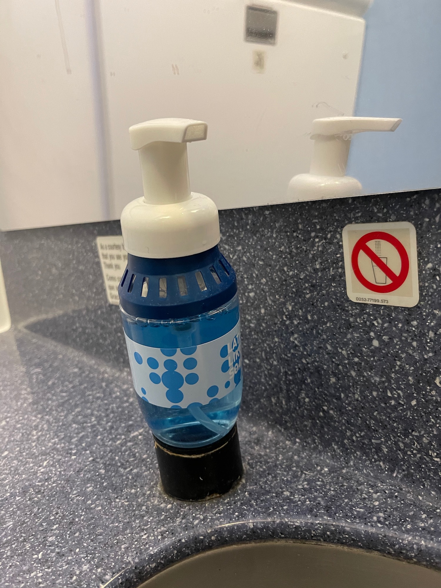 a soap dispenser on a counter