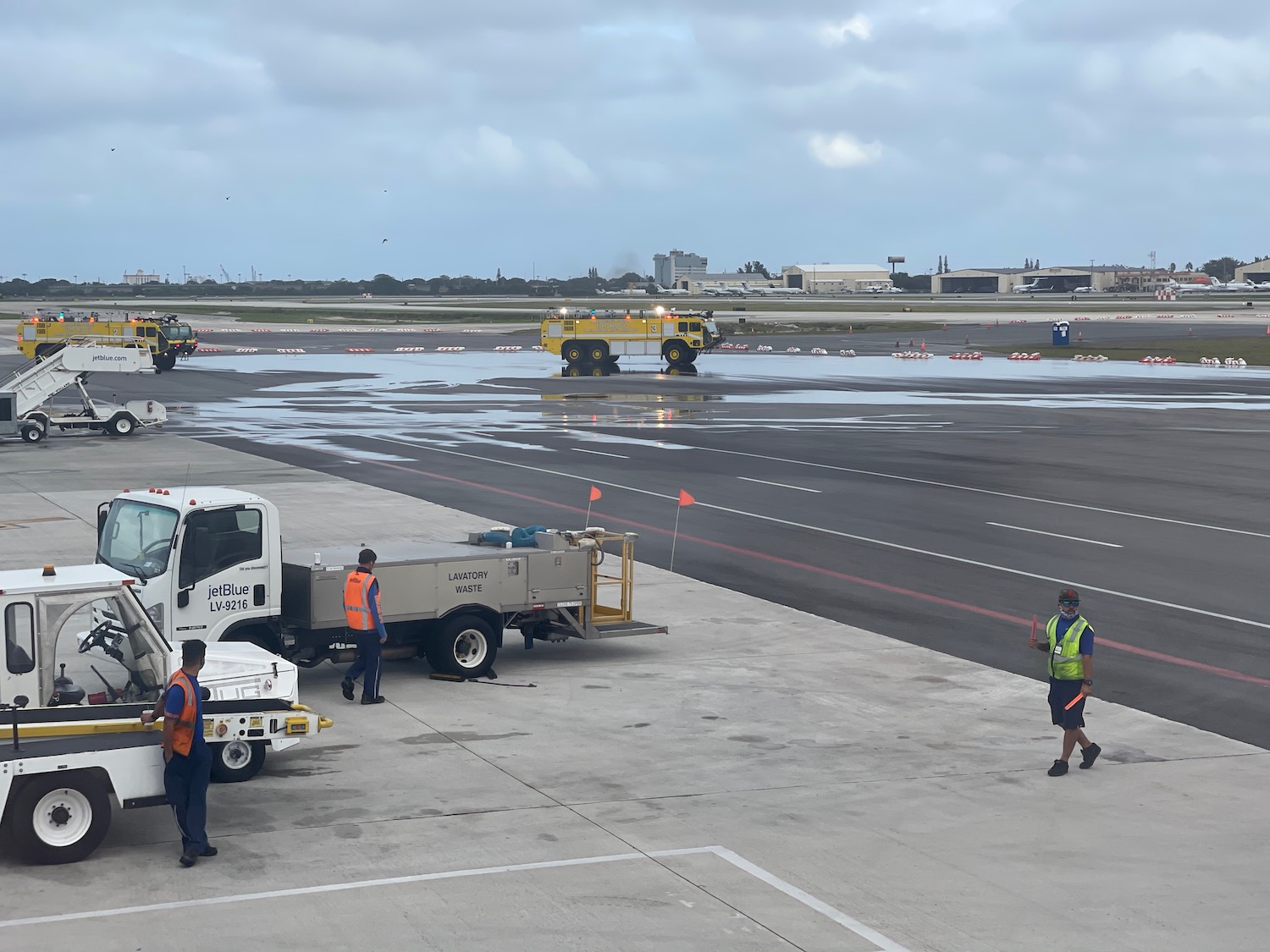 a group of people standing on a runway