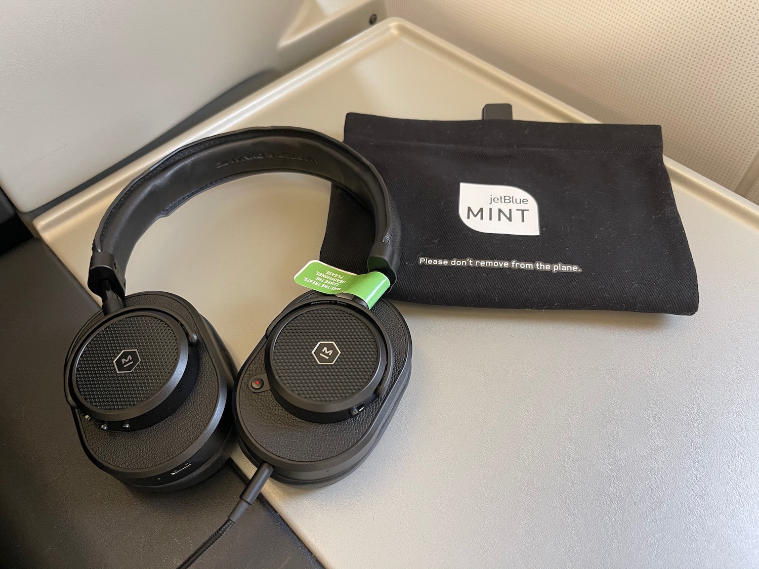 a pair of headphones next to a bag