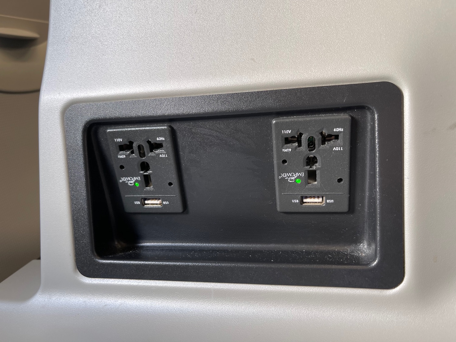 a black outlet with a black rectangle on the side
