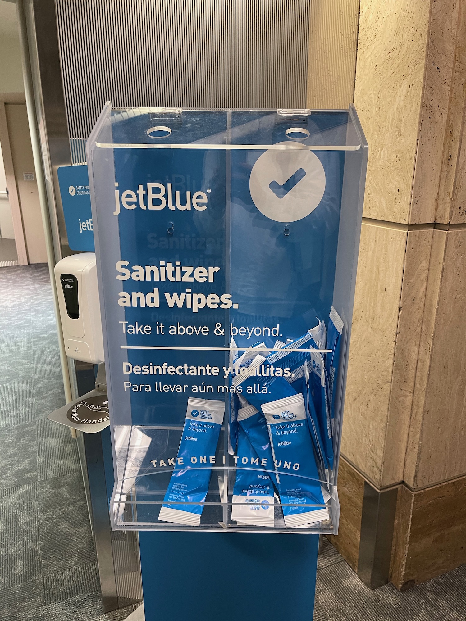 a clear box with blue packages of wipes
