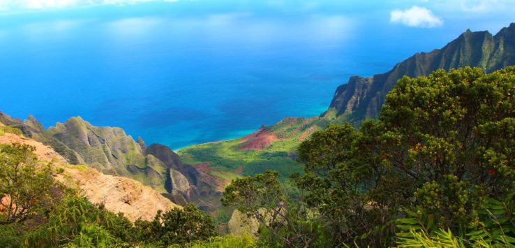 a view of a mountain range and the ocean