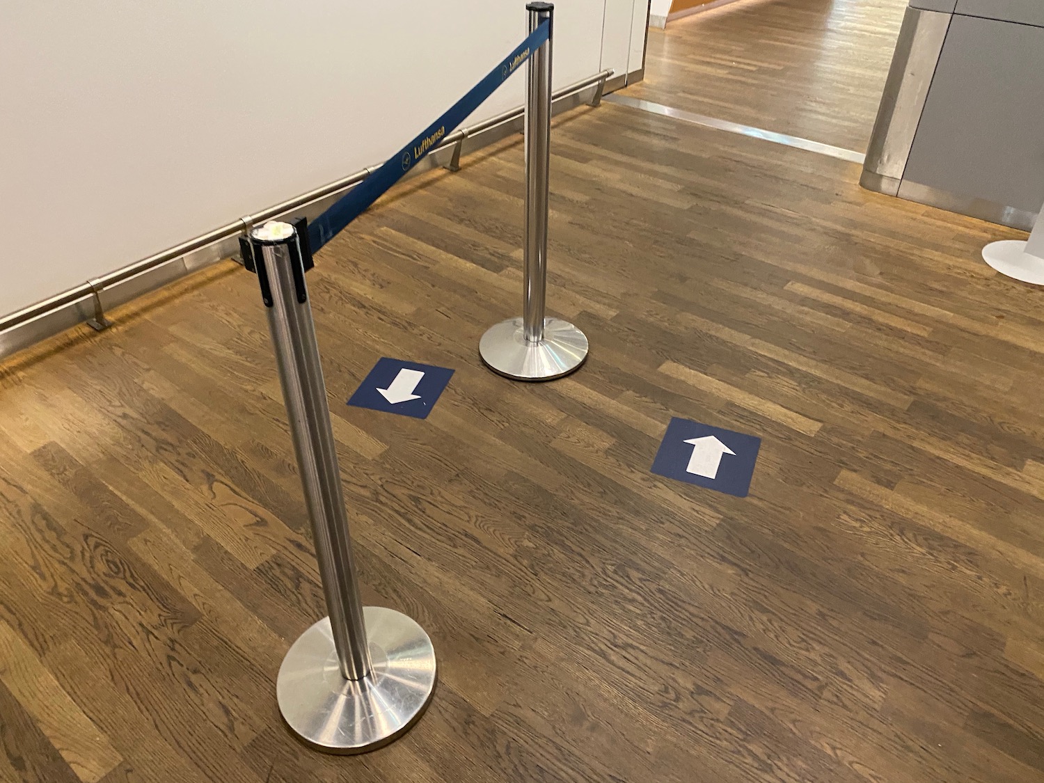 a blue and silver pole with a blue tape on the floor