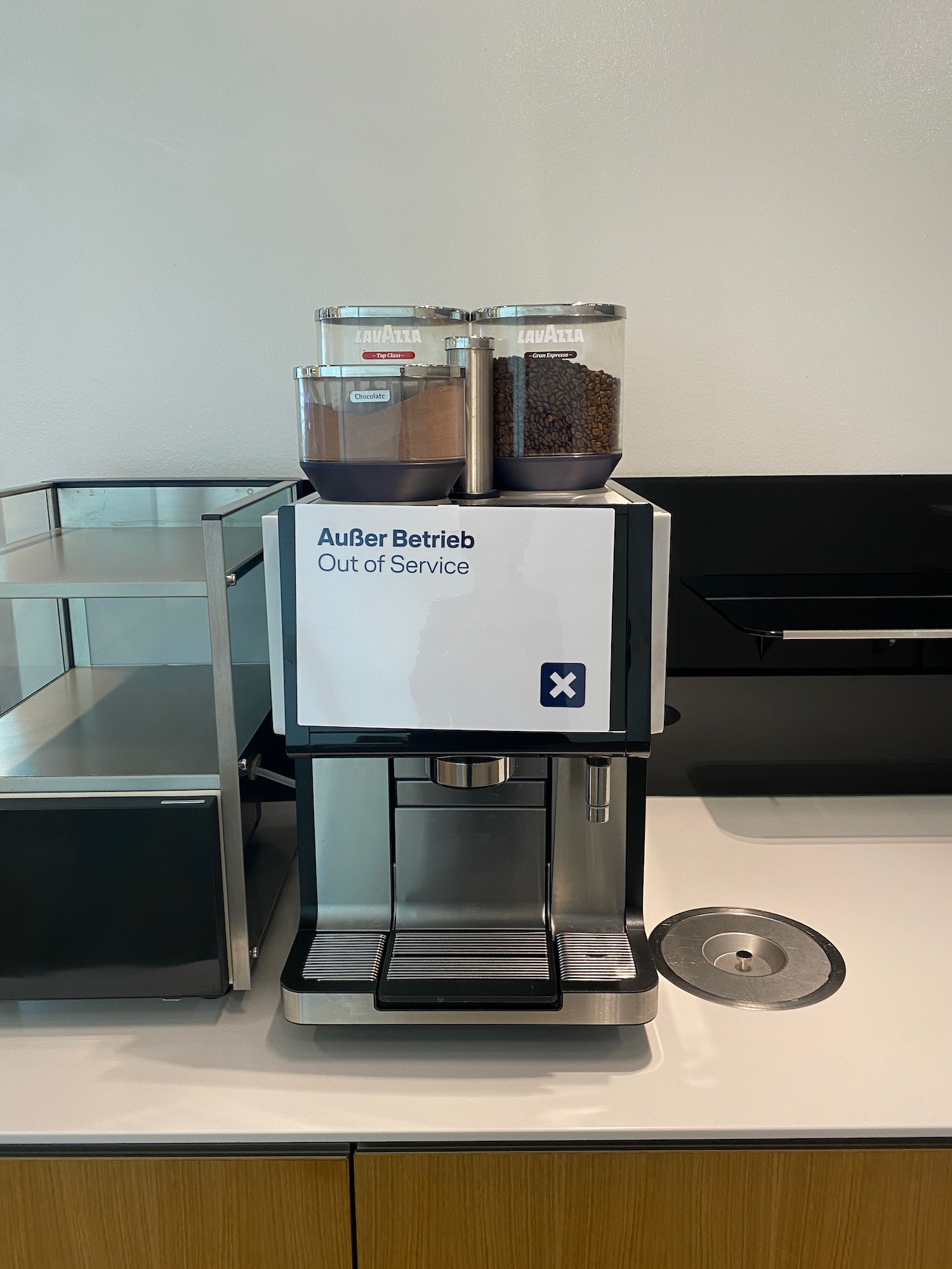 a coffee machine with a container of coffee beans on top
