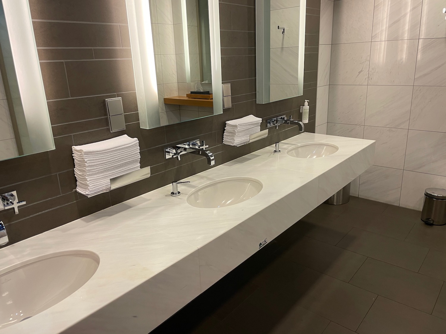 a bathroom with sinks and mirrors